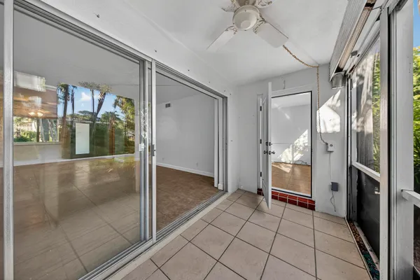 a view of a hallway view with wooden floor and staircase