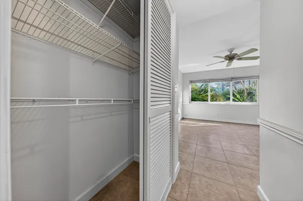 a bathroom with a window and a shower