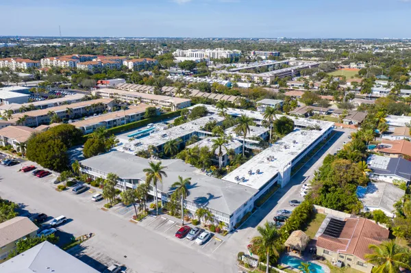 an aerial view of residential houses with outdoor space