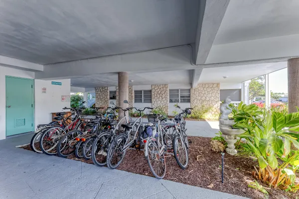 a view of a swimming pool with a patio and a yard