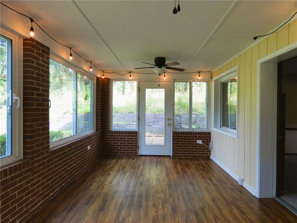 8459 Ridgemont Road Pittsburgh, PA 15237 - Photo 29 of 31 Exit the interior onto your private side patio from this bright and airy attached sunroom