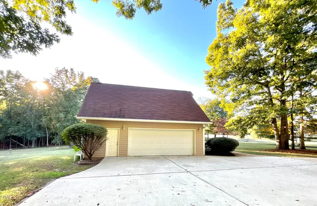 a view of a backyard with swimming pool