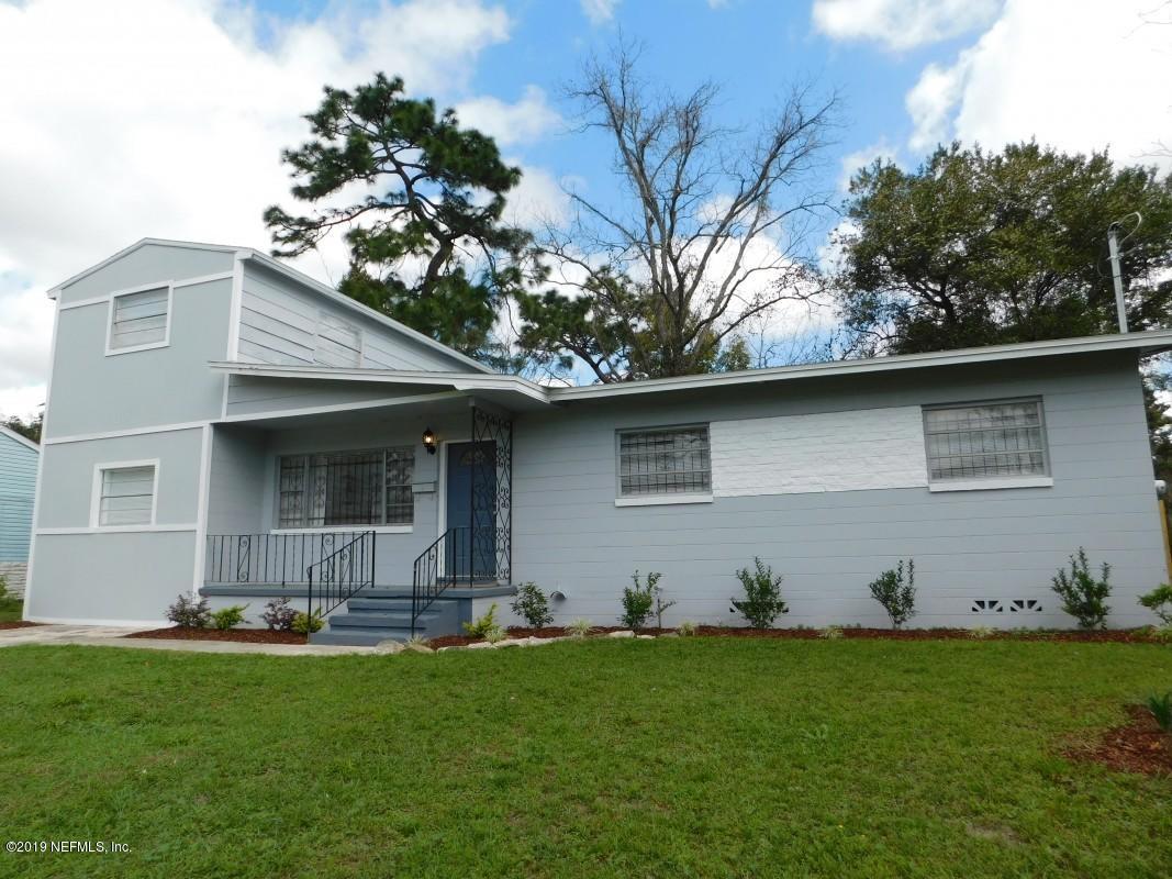 6829 Corday Road Jacksonville, FL 32208 - Photo 1 of 24 a front view of a house with garden