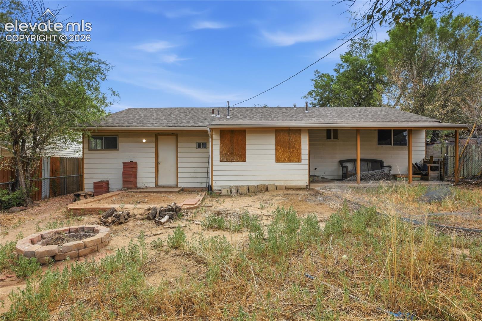 601 Huron Road Colorado Springs, CO 80910 - Photo 32 of 34 BACKYARD ALREADY FEATURES A COVERED PATIO AND FIRE PIT