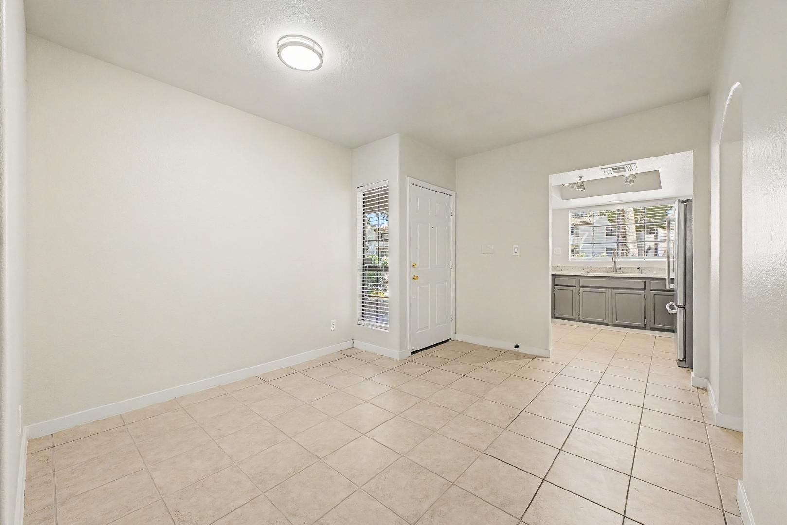 6885 East Cochise Road, Unit 142 Paradise Valley, AZ 85253 - Photo 12 of 47 an empty room with windows