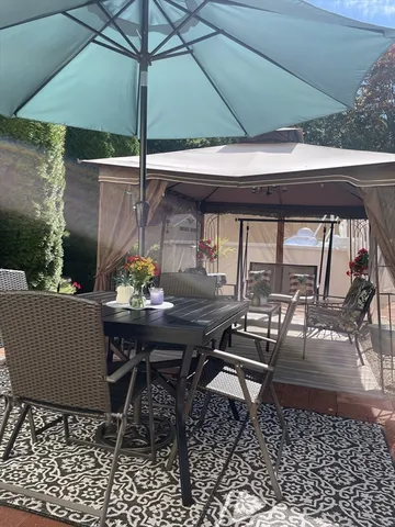 a view of backyard with outdoor seating