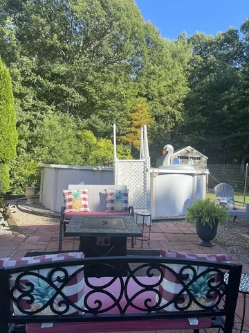 a wooden bench sitting in front of a building