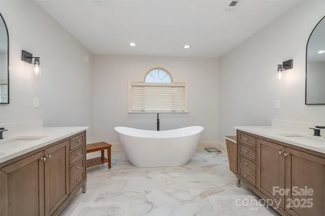 a spacious bathroom with a sink and a bathtub