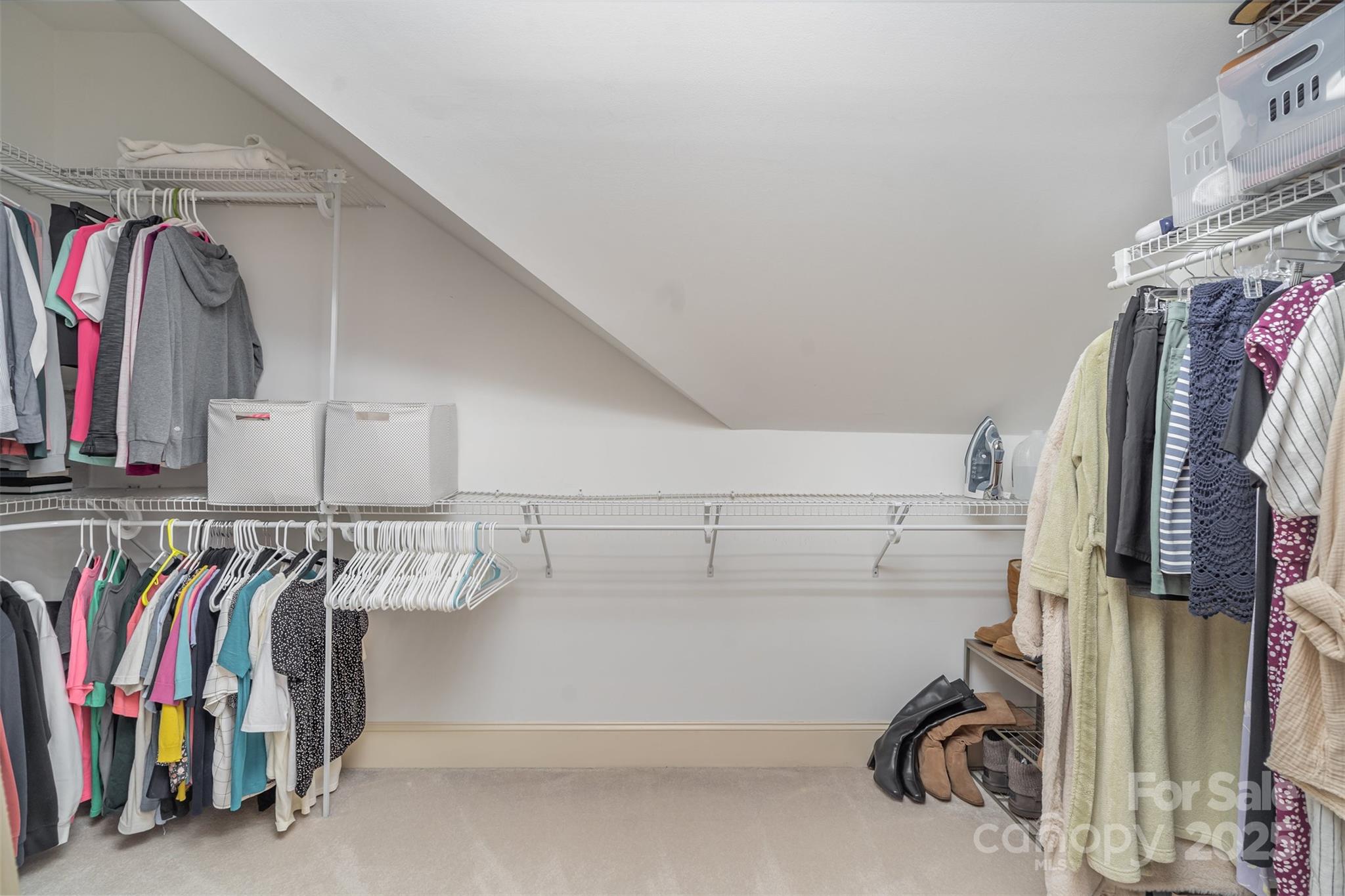 9021 Unbridle Lane Waxhaw, NC 28173 - Photo 25 of 48 a view of walk in closet with clothes and shoes