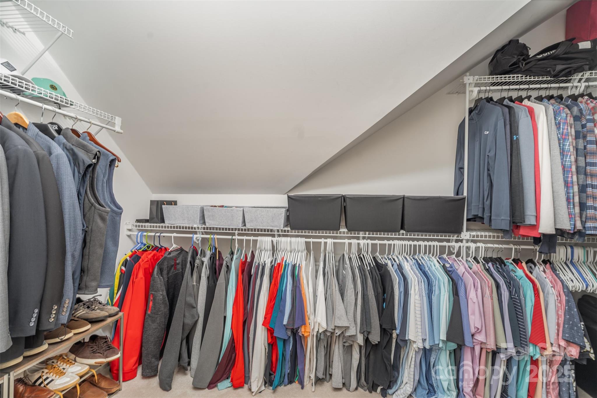 9021 Unbridle Lane Waxhaw, NC 28173 - Photo 26 of 48 a view of walk in closet with clothes and shoes