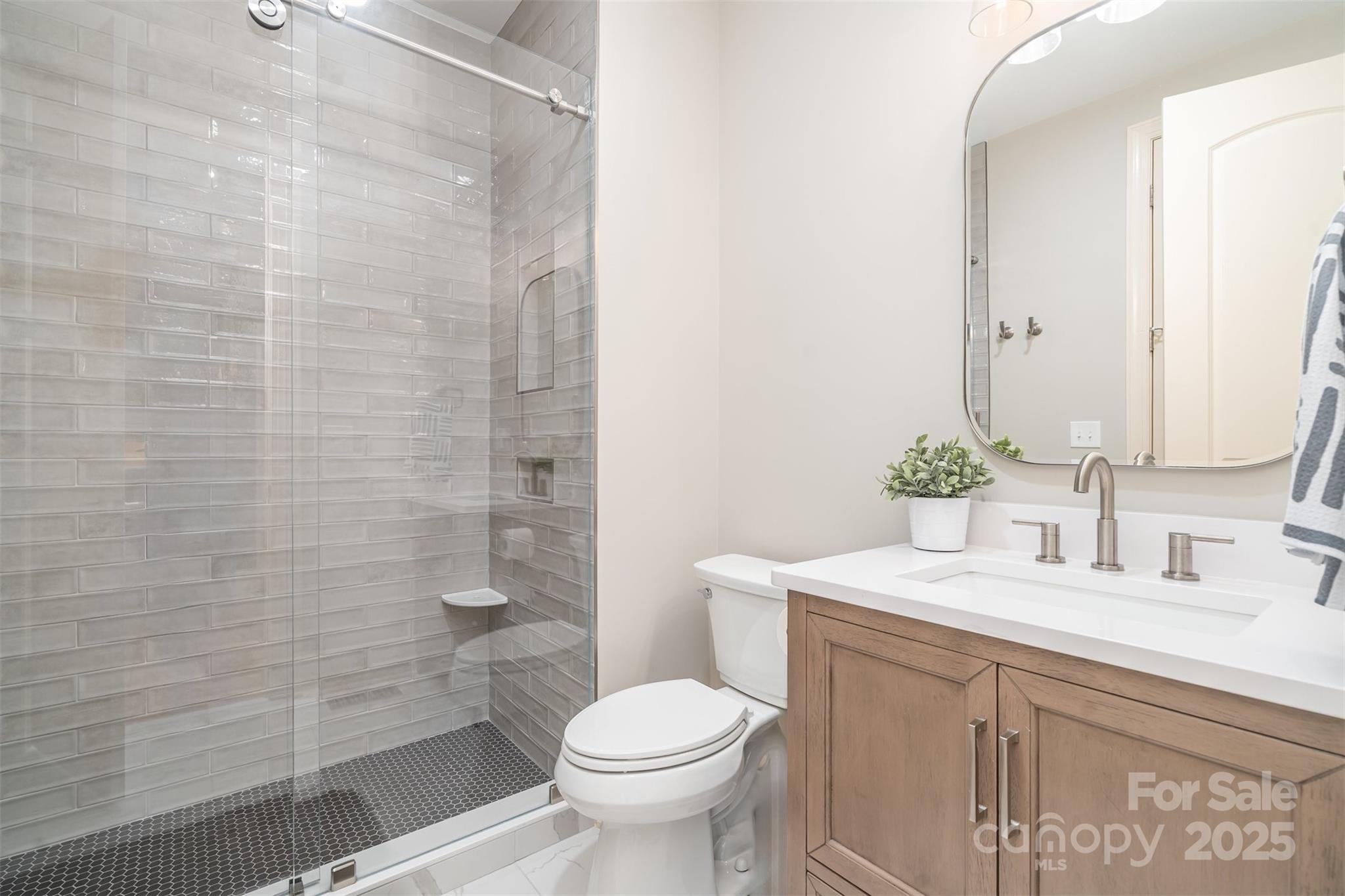 9021 Unbridle Lane Waxhaw, NC 28173 - Photo 28 of 48 a bathroom with a sink toilet and shower