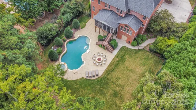 an aerial view of a house with garden space sitting space and swimming pool