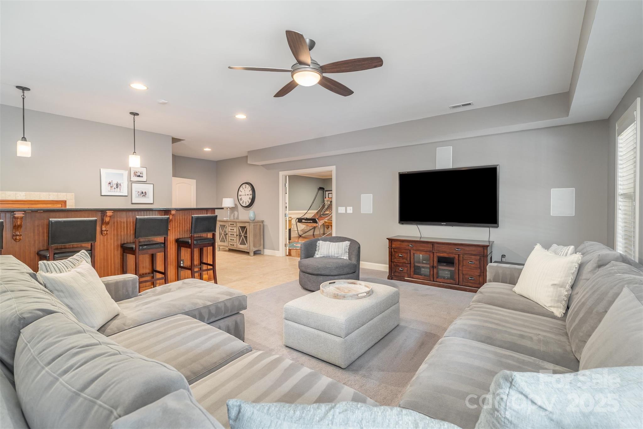 9021 Unbridle Lane Waxhaw, NC 28173 - Photo 34 of 48 a living room with furniture kitchen view and a flat screen tv