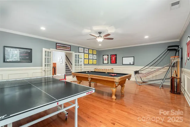 a living room with dining room and wooden floor