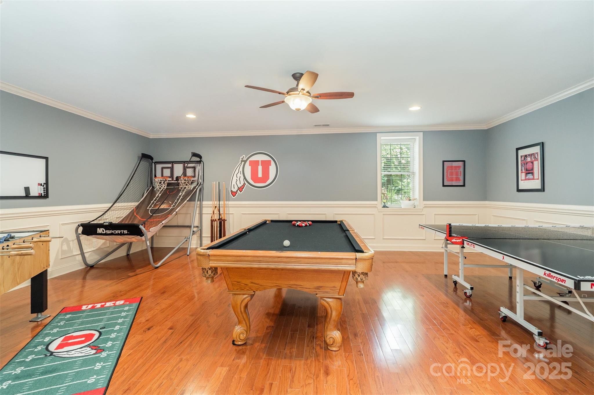 9021 Unbridle Lane Waxhaw, NC 28173 - Photo 38 of 48 a living room with a gaming machine and a table