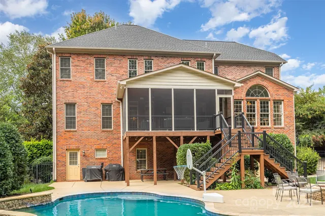 a front view of a house with a yard and porch