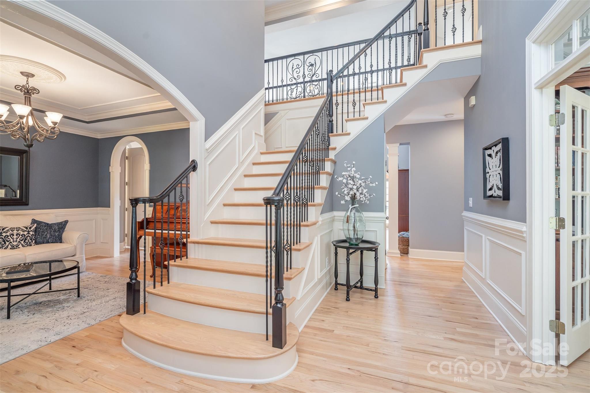 9021 Unbridle Lane Waxhaw, NC 28173 - Photo 7 of 48 a view of entryway and hall with wooden floor
