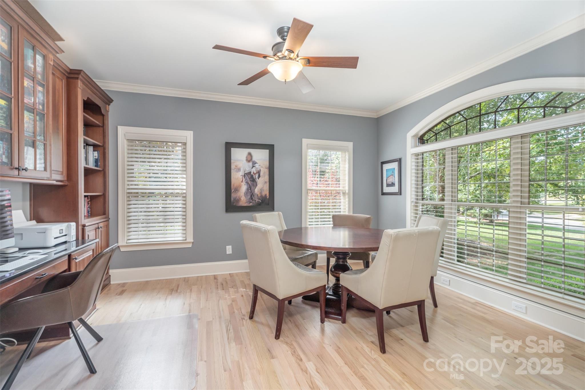 9021 Unbridle Lane Waxhaw, NC 28173 - Photo 9 of 48 a dining room with furniture a chandelier and wooden floor