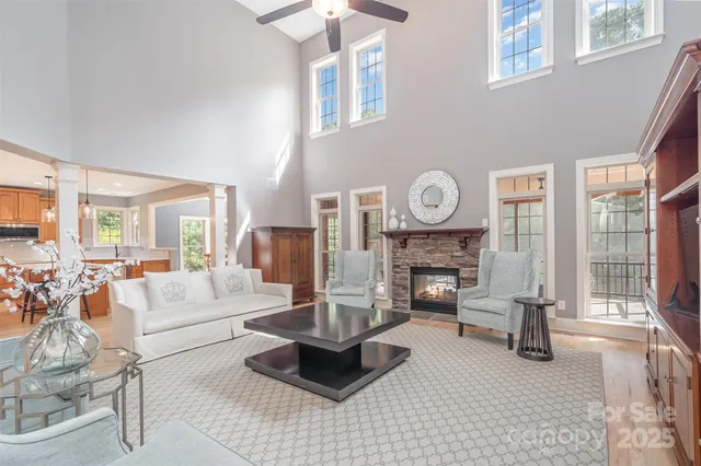 a living room with fireplace furniture and a fireplace