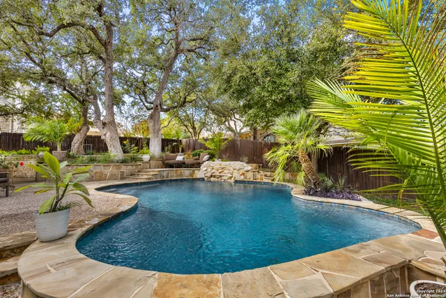 a view of a swimming pool with an outdoor space
