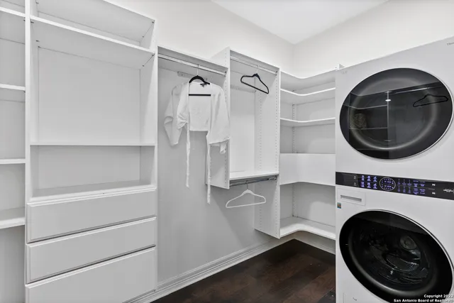 a utility room with sink dryer and washer