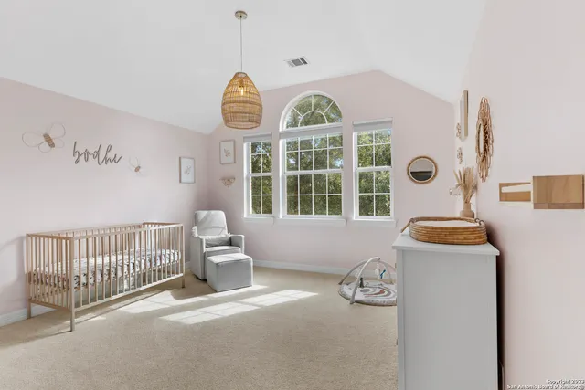 a bedroom with bed and a window