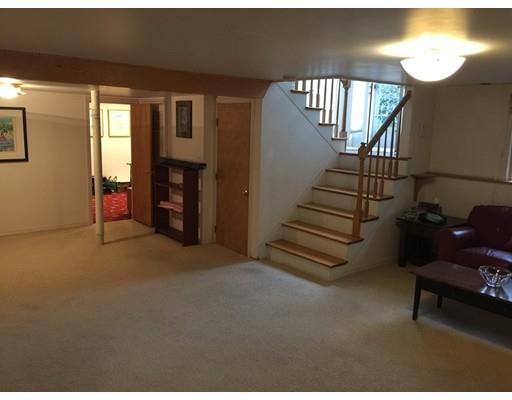 28 Peterson Road Natick, MA 01760 - Photo 24 of 30 a view of empty room with stairs and wooden floor