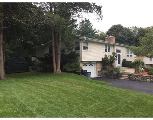 28 Peterson Road Natick, MA 01760 - Photo 3 of 30 a view of a backyard with plants and large tree