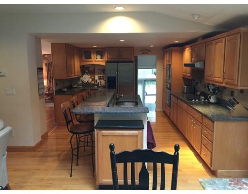 28 Peterson Road Natick, MA 01760 - Photo 8 of 30 a kitchen with dining table and chairs