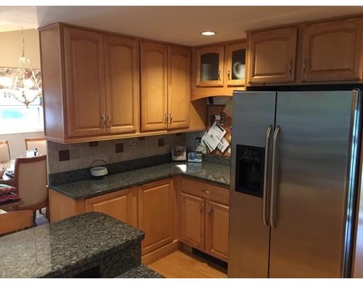 28 Peterson Road Natick, MA 01760 - Photo 10 of 30 a kitchen with stainless steel appliances granite countertop a refrigerator and a sink