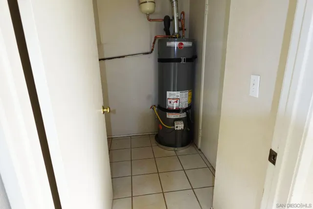 a view of storage and utility room with a sink