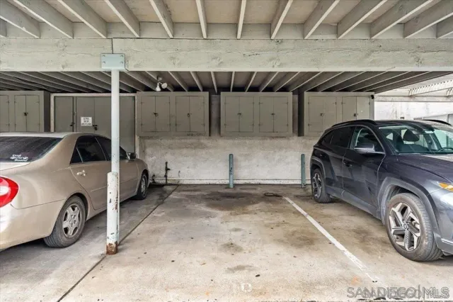 a view of parking garage with cars