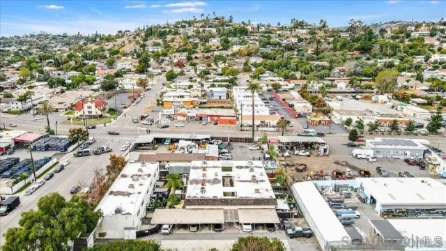 an aerial view of residential building with parking
