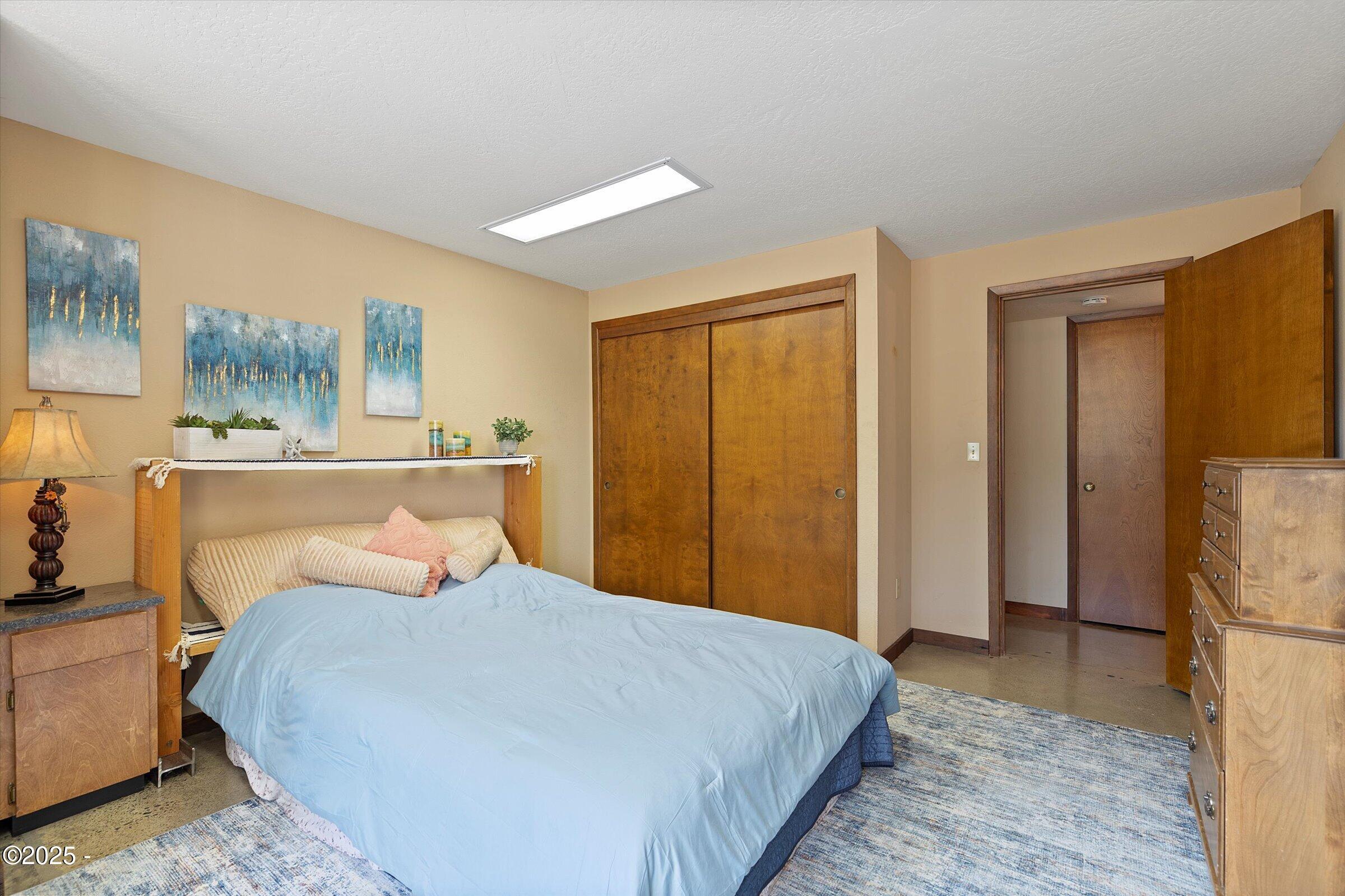 21560 Gooseneck Road Sheridan, OR 97378 - Photo 47 of 63 a bedroom with a bed and a refrigerator