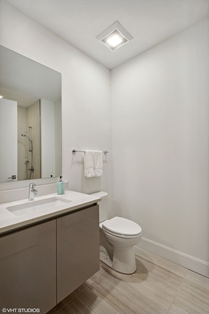 36 North Carpenter Street, Unit 2N Chicago, IL 60607 - Photo 15 of 25 a bathroom with a sink and a toilet