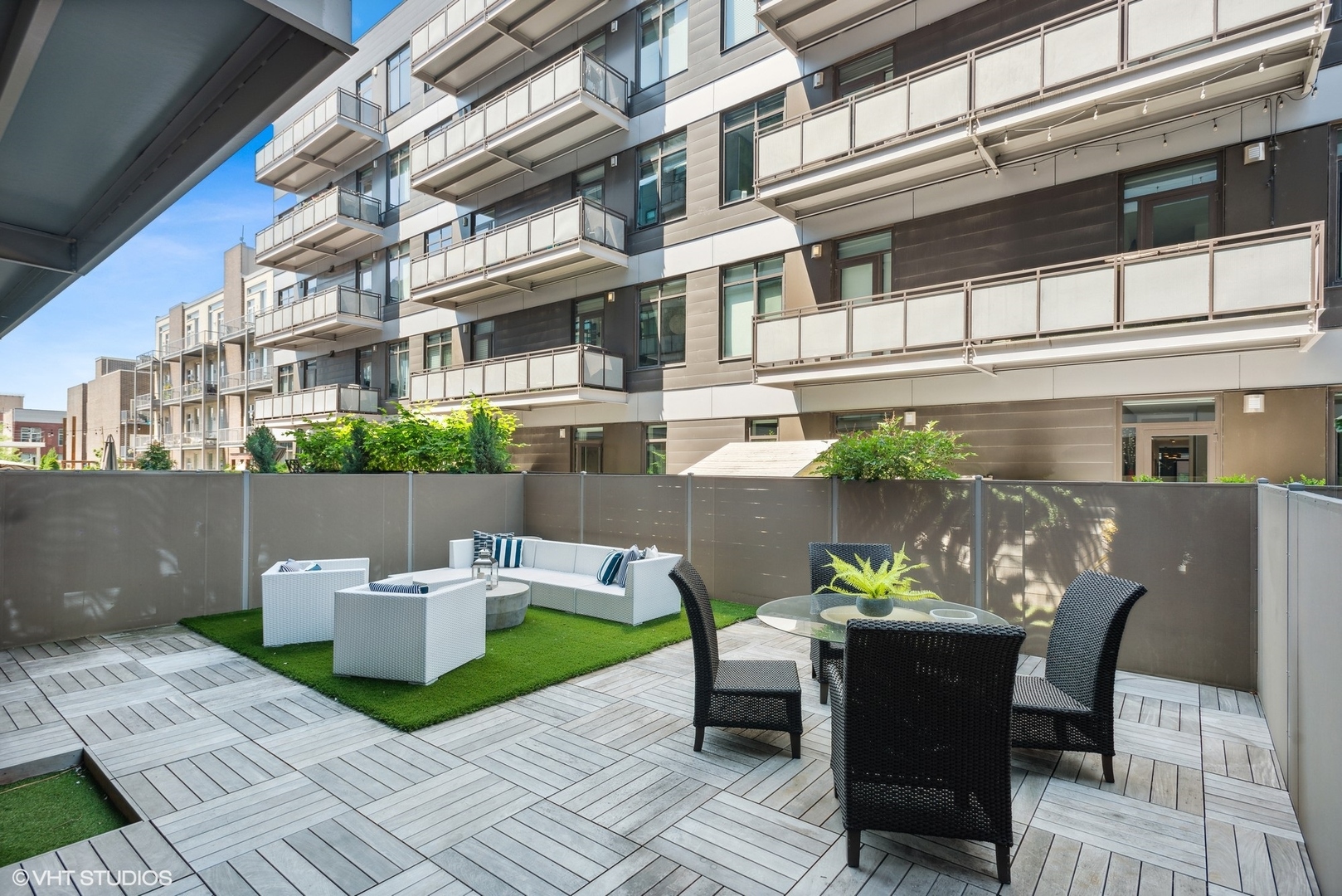 36 North Carpenter Street, Unit 2N Chicago, IL 60607 - Photo 24 of 25 a view of a patio with couches table and chairs and potted plants