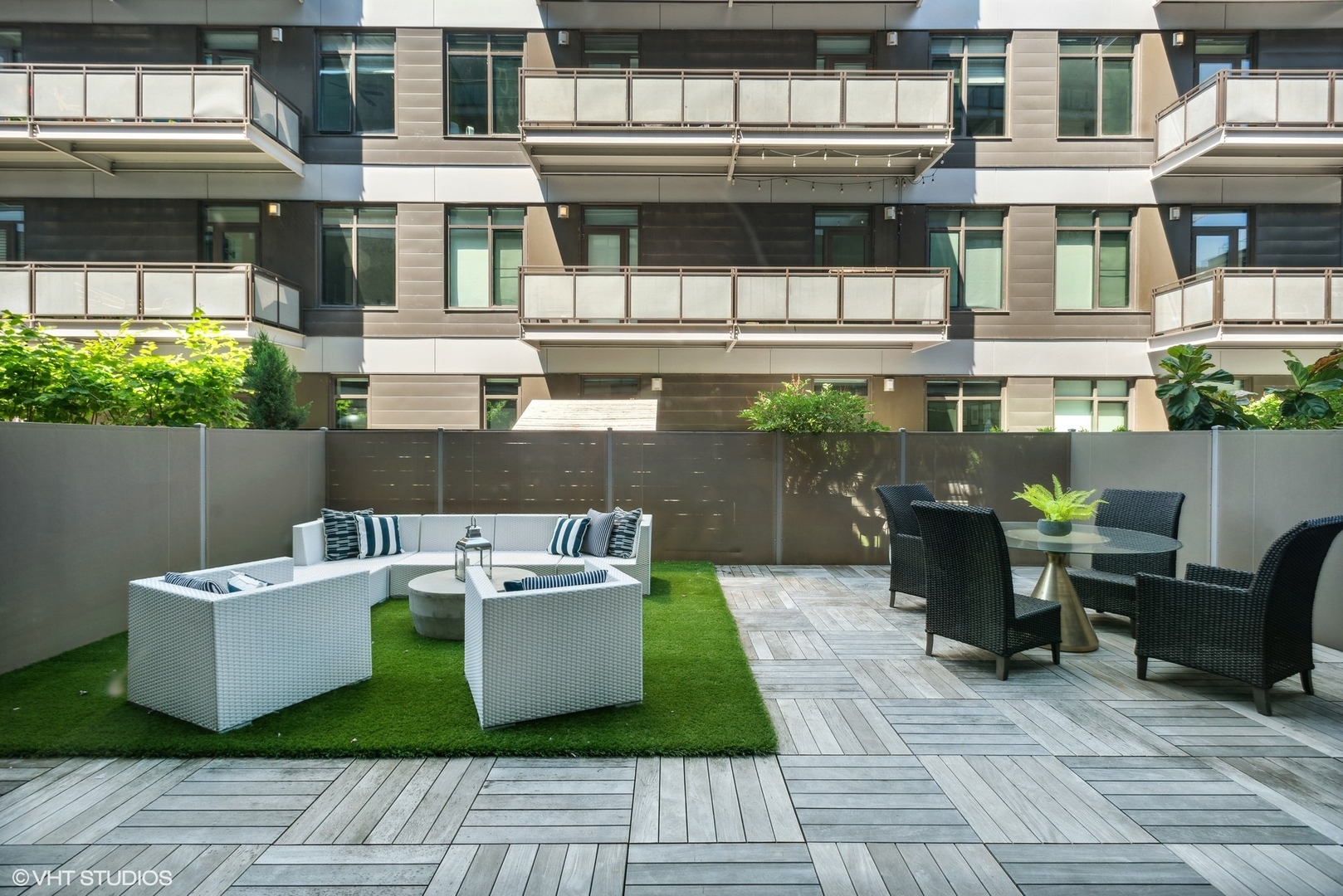 36 North Carpenter Street, Unit 2N Chicago, IL 60607 - Photo 25 of 25 a view of a patio with couches table and chairs and potted plants