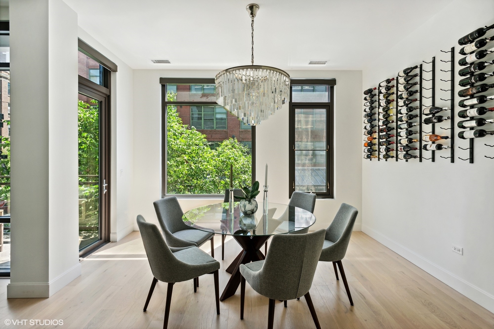 36 North Carpenter Street, Unit 2N Chicago, IL 60607 - Photo 7 of 25 a dining room with furniture window chandeliers