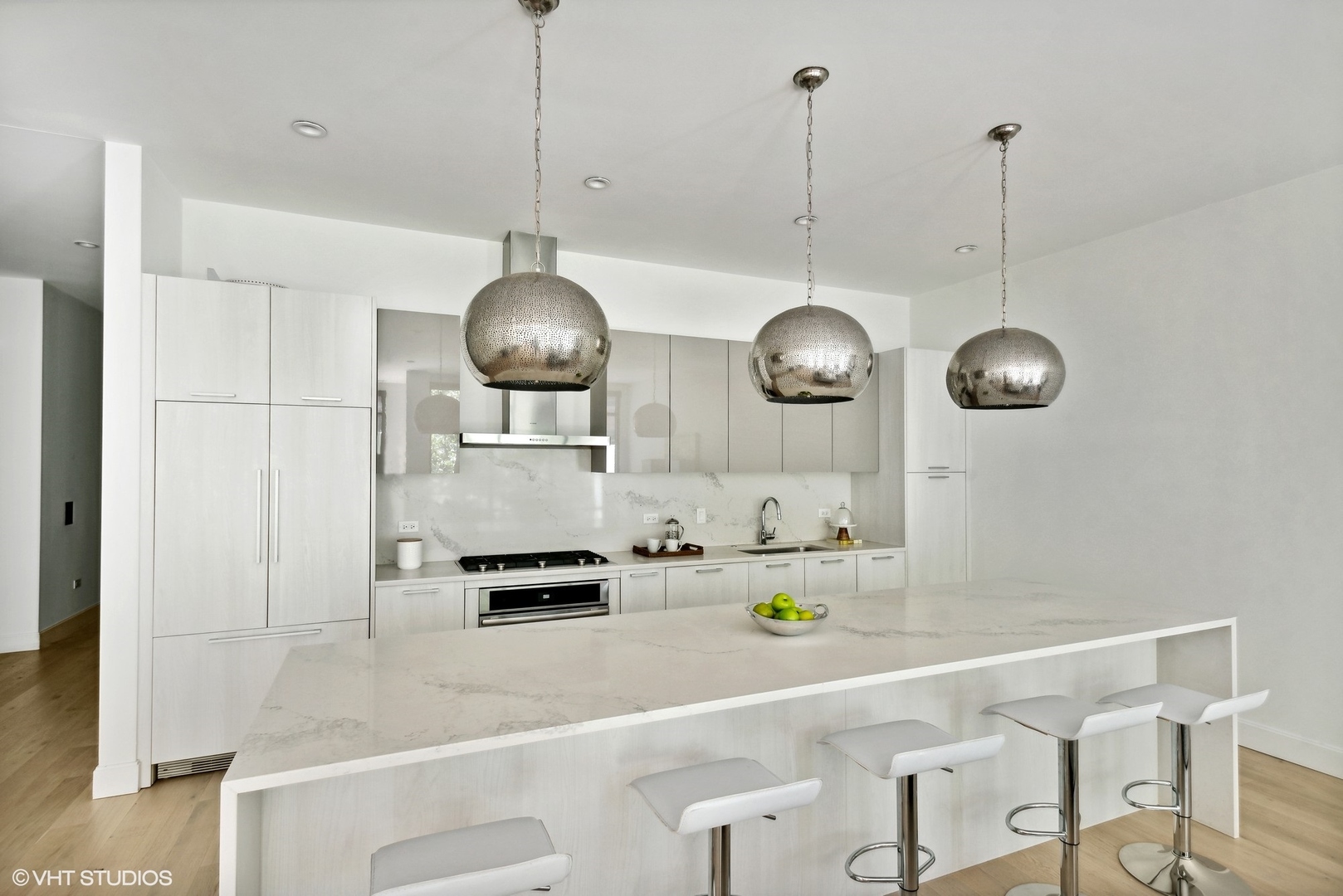 36 North Carpenter Street, Unit 2N Chicago, IL 60607 - Photo 9 of 25 a kitchen with a refrigerator a sink and cabinets