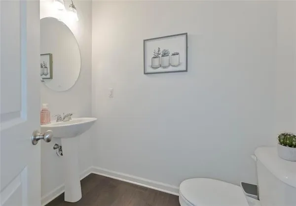 a bathroom with a toilet and a sink