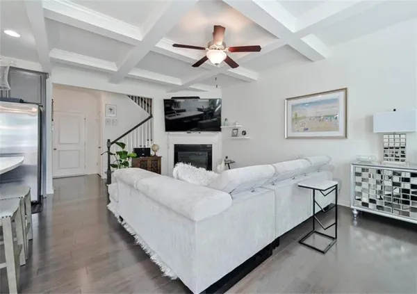 a living room with furniture fireplace and flat screen tv