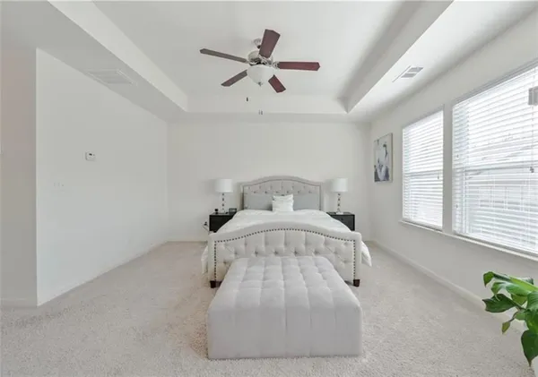 a bedroom with a bed and window