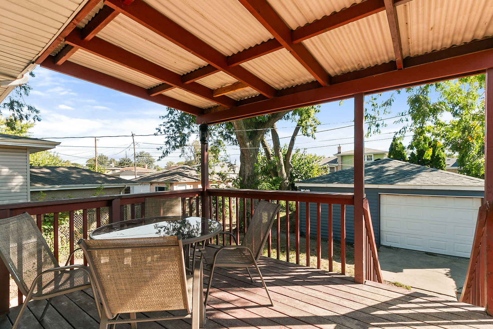 15221 Oak Street Dolton, IL 60419 - Photo 15 of 16 a view of a balcony with chairs and wooden floor