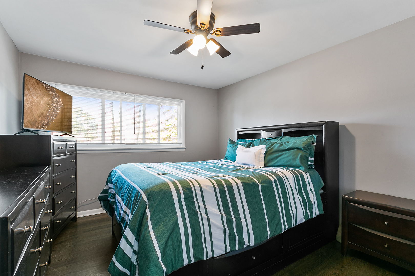 15221 Oak Street Dolton, IL 60419 - Photo 8 of 16 a bedroom with a bed dresser and a window