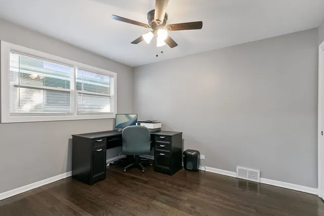 a workspace with furniture and a window