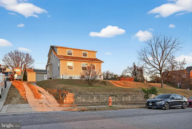 a view of a car parked in front of a house