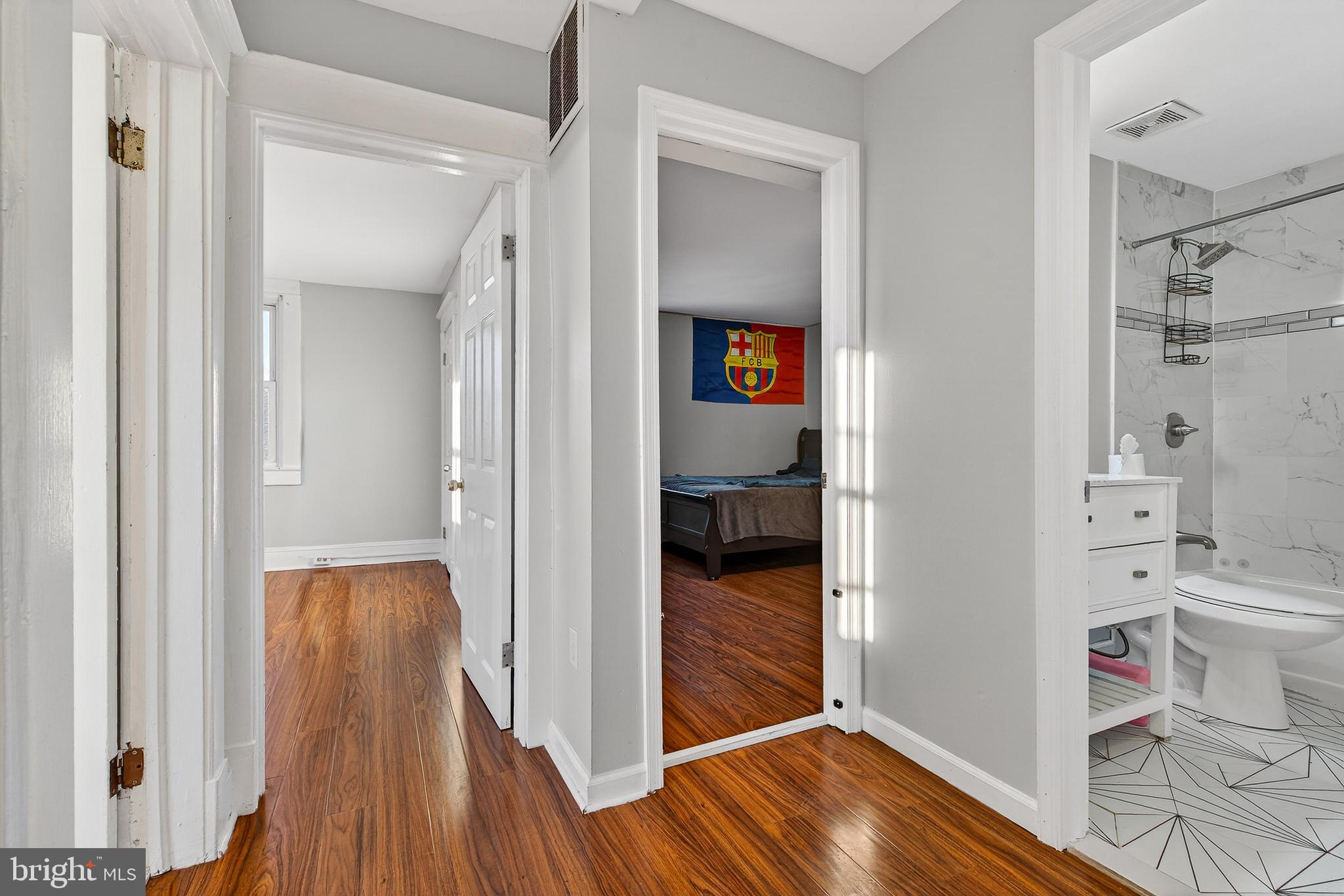 511 47th Street Baltimore, MD 21224 - Photo 14 of 44 a view of a hallway with wooden floor and closet
