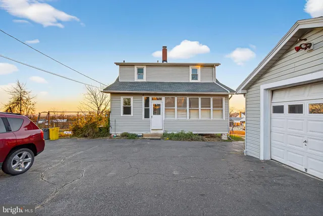a front view of a house with a garage