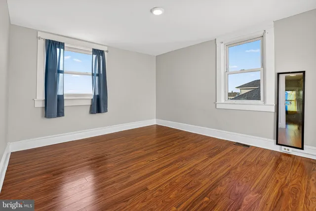 a view of an entryway with wooden floor