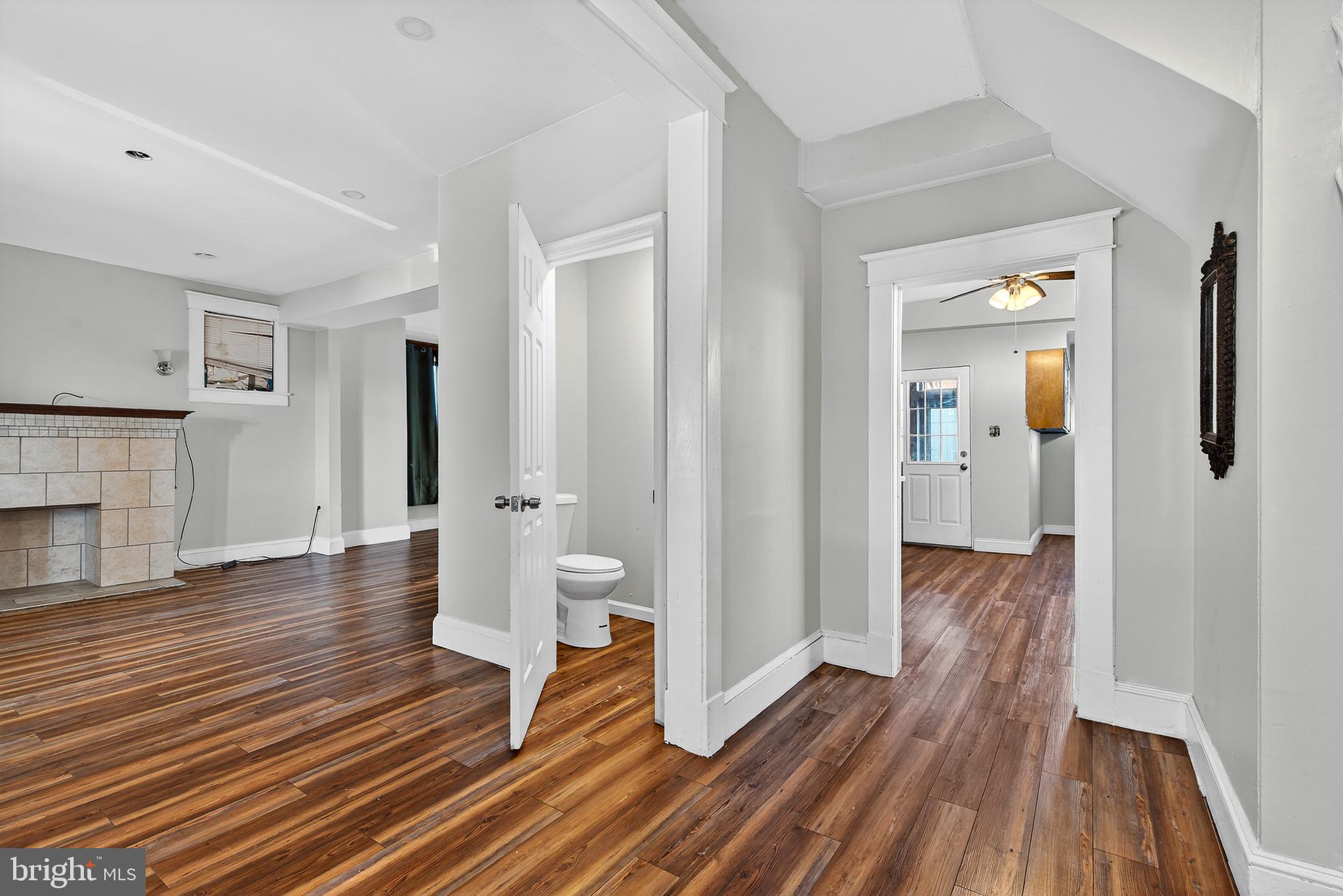511 47th Street Baltimore, MD 21224 - Photo 28 of 44 a view of a hallway with wooden floor and staircase
